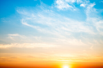 Obraz premium Beautiful , luxury soft gradient orange gold clouds and sunlight on the blue sky perfect for the background, take in evening,Twilight, Large size, high definition landscape photo