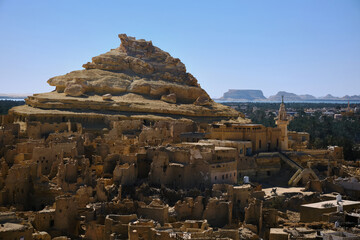 Remains of mud-brick houses of Shali fortress and Shali Mountain in Siwa Oasis, Egypt