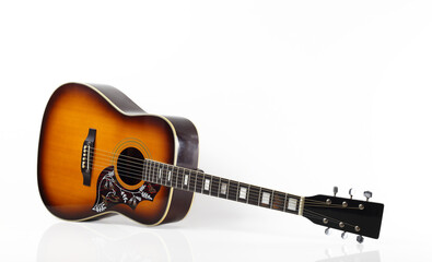 Musical instrument - Western acoustic guitar with a reflection white background