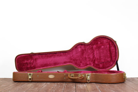 Musical instrument - Side view Open brown electric guitar hard case