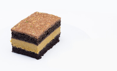 Dubai chocolate cake with layered pistachio filling on white background