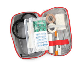 First aid kit. Different medical supplies in bag isolated on white, top view