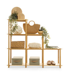 Wooden shelving unit with different home decor isolated on white