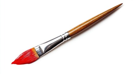 Red paintbrush with wooden handle isolated on white background.