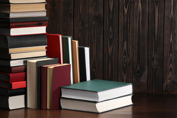 Many different old books on wooden table
