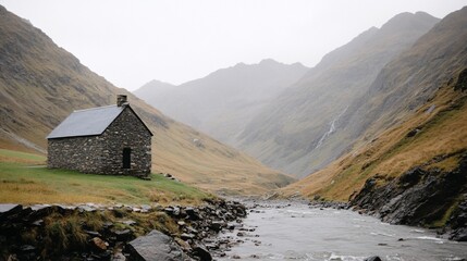 Rustic stone chapel nestled in a valley, surrounded by misty mountains