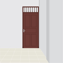 Classic brown door in a room with gray walls.