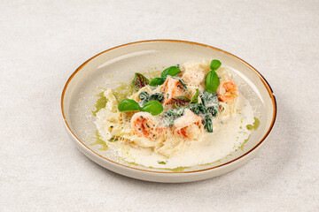 Portion of gourmet fettuccine with shrimps in cream sauce