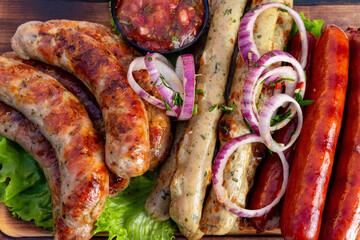 Grilled sausages served with fresh toppings and salsa