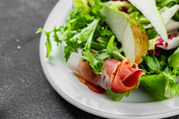 Salad pear ham vegetable dish fresh tasty gourmet food background on the table rustic food top view copy space