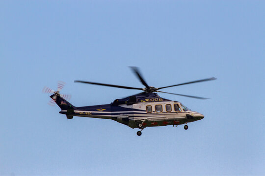 Ho Chi Minh City, Vietnam - April 23, 2022 : An AgustaWestland AW139 (Also Called Leonardo AW139) Helicopter With Registration 9M-WBC Landing At Tan Son Nhat International Airport.