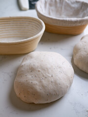 Sourdough Bread in Proofing basket, bannetons baskets for retarding raw dough before baking.