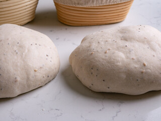 Sourdough Bread in Proofing basket, bannetons baskets for retarding raw dough before baking.