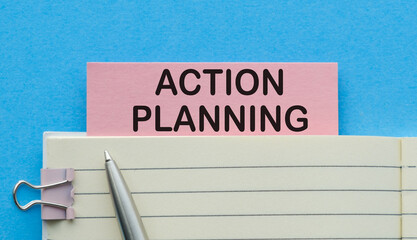 Action Planning Concept with Notebook and Pen