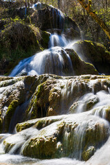 Fototapeta premium Petrifying waterfalls of Roquefort, in Ariège, formed by the water of the Turasse springs