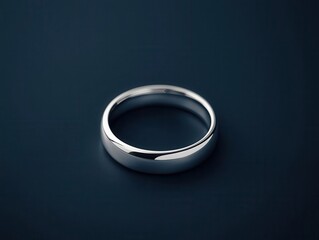 Simple silver wedding ring with a smooth, polished surface, a classic minimalist design