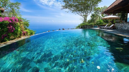 Obraz premium Cliffside infinity pool overlooking the ocean, tropical paradise