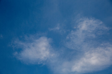 Magic blue sky with fluffy white clouds. Summer sky. 