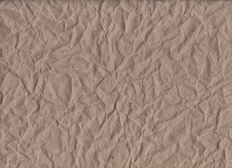 Brown crumpled kraft paper. background with vintage texture. The background is made of crumpled brown paper with a crafting effect. Vintage design, packaging, scrapbooking, banner, posters, eco-style 