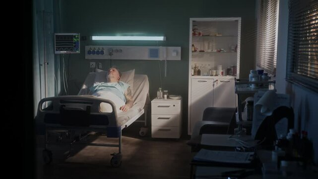 Elderly man with grey beard sleeps on comfortable bed in ward