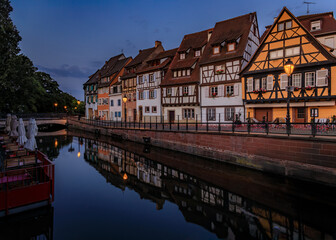 Ornate half timbered houses with blooming flowers along the canals, Little Venice district in...