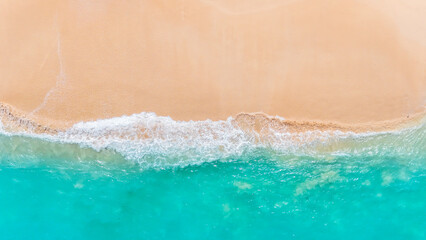 aerial capture of a tropical beach paradise with clear blue ocean waves. summer background and summer holiday concept. © Balnyes Visuals