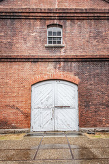 Red Brick Warehouse with Weathered White Doors, Maizuru, Kyoto, Japan