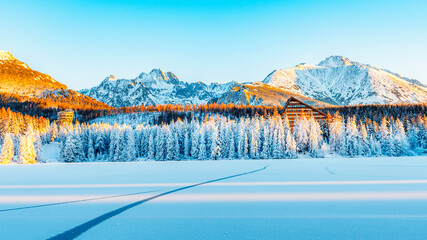 Frozen winter mountain lake Strbske pleso. Strbske lake with view of the High Tatras National Park, Slovakia