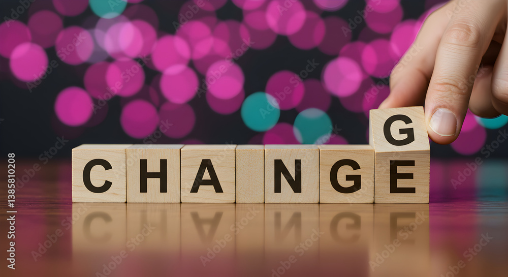 Poster hand arranging wooden blocks spelling change on wooden table with bokeh background