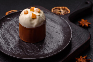 Easter sweet cake covered with icing with fruit and candied fruits