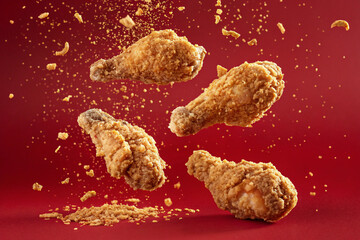 Fried chicken on red background. Spices. Christmas.