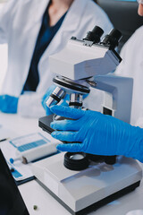 Chemists in a lab developing cosmetic products, testing and analyzing formulas for quality and effectiveness.