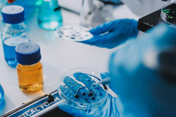 Chemists in a lab developing cosmetic products, testing and analyzing formulas for quality and effectiveness.