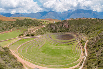 Moray circular terraces in Peru near Cusco city in sacred valley of Incas cultural and historical archeological heritage of South America. Green terraces in the Andes Moray circles in spring