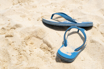 blue slates lying in sand in the sun, vacation concept	