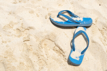 blue slates lying in sand in the sun, vacation concept