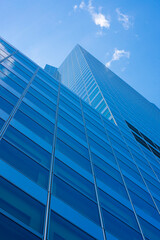 Obraz premium Upward view of facade of downtown office building.