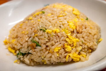 Fried rice in Japanese style, called Cha han, on white dish in Japanese restaurant