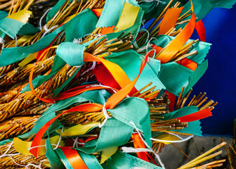 Group of Easter pom-poms made from natural willow wicker with colorful ribbons