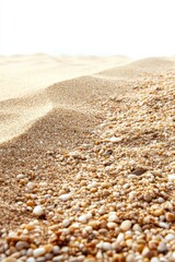 Fototapeta premium Serene beachscape featuring soft sand and smooth pebbles under bright sunlight creating a peaceful and natural atmosphere for relaxation and tranquility