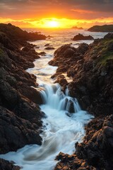 Obraz premium Dramatic sunset over coastal waterfall cascading through rocky landscape nature photography style