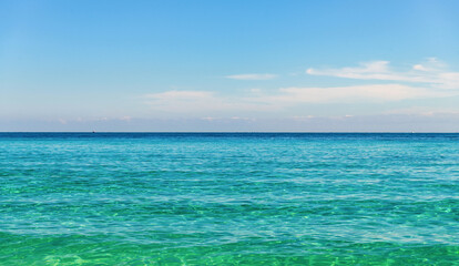 Aquamarine ocean nature. Background of clear turquoise sea water. Idyllic summer vacation. Mediterranean sea. Rippled surface. Ocean beach. Sea water surface. Ripple water of ocean
