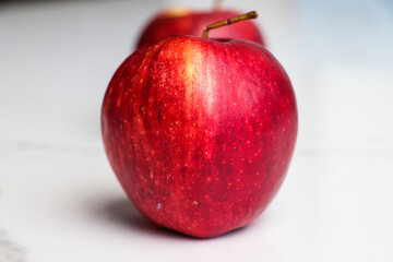 Close-Up of Two Apples on a Smooth Surface.