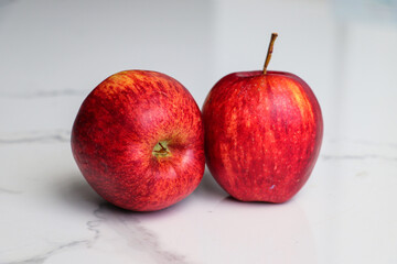 Red Apples Arranged Closely on White Surface