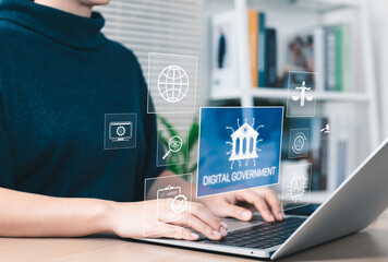 Digital government and E-governance concept. Person using laptop with icons e-governance,...