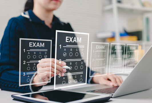 Online exam and digital assessment concept. Woman taking digital multiple-choice exam on laptop with transparent answer sheets, representing online education and testing. quiz, survey, questionnaire,