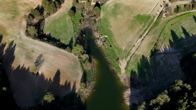 Aerial drone view of Lake Manzano between Bullas and Mula, Murcia Region, Spain, with the Sierra de Burete mountains in the background.