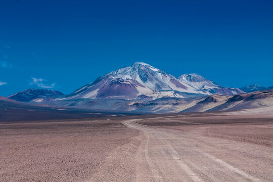 Atacama desert landscape in the Andes mountains of Chile in the Ojos del Salado area highest volcano on Earth. Dry arid desert soil and sand on the altiplano high altitude Andean palins South America