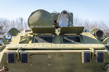Green old russian BTR-80 armored military vehicle with open hatches