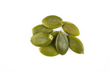 Delicious pumpkin seeds on white background